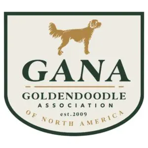 A dog is standing in front of the gana logo.